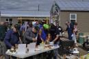 Rendezvous Members Holding a Fund Raising BBQ in Carcross