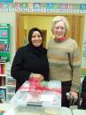 Rotary member with woman refugee gift recipient