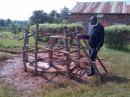 a protective fence is built to prevent the children damaging the pump