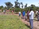 the community arrives to discuss where to put the borehole