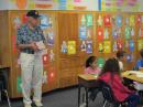 Rotarian Bill Bonner distributing dictionaries to 3rd graders.