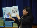 Rotarian Mona Rios Reading to the Kids at Kimball Elementary